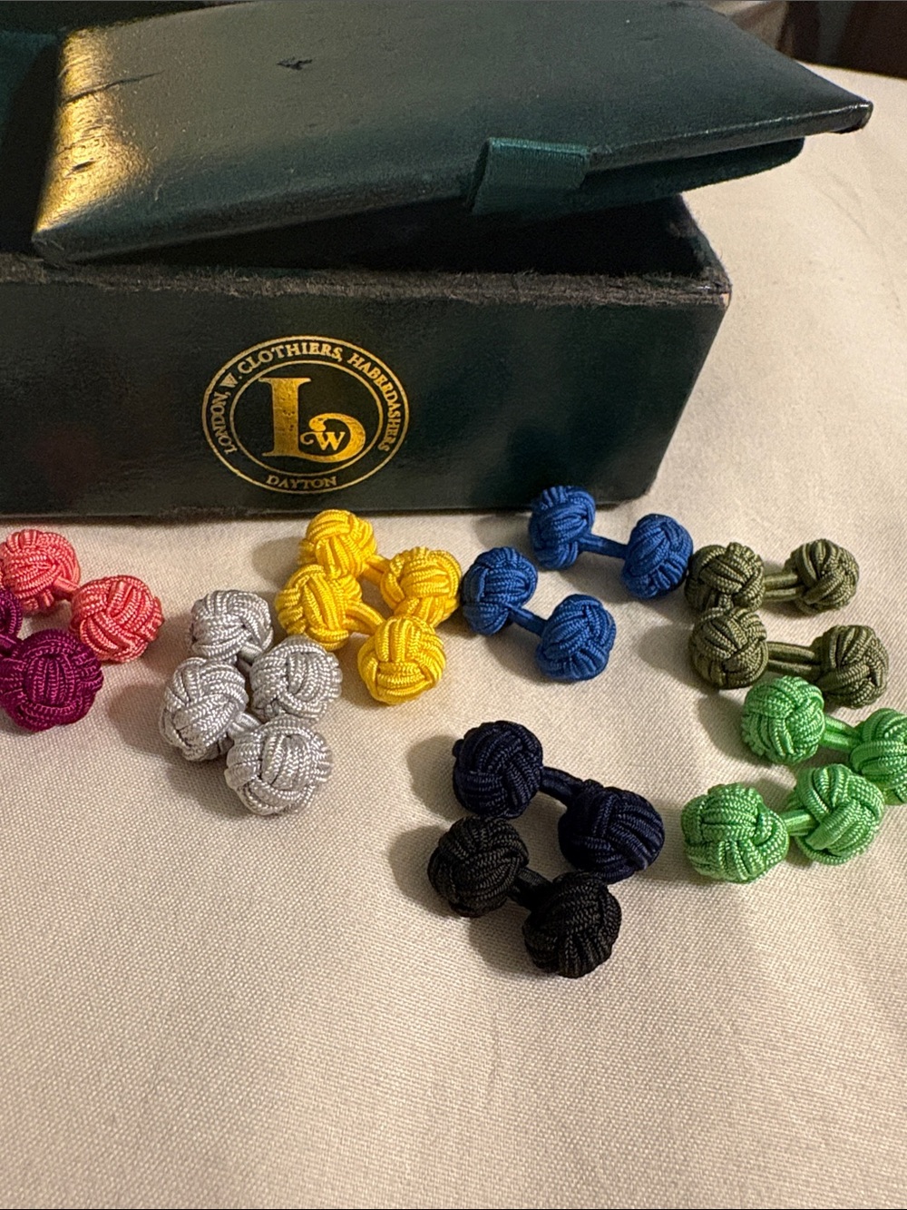 London W. Clothiers & Haberdashers vintage box & several silk knot cuff links